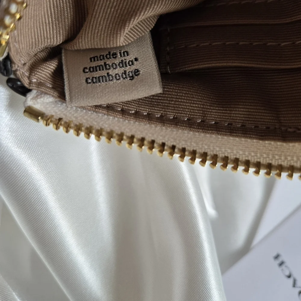 Coach White and Cream Signature Monogrammed Wristlet.